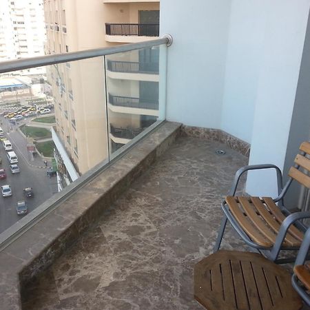 Hilton Alexandria Corniche Hotel Bagian luar foto A balcony in a residential building in Cairo, Egypt