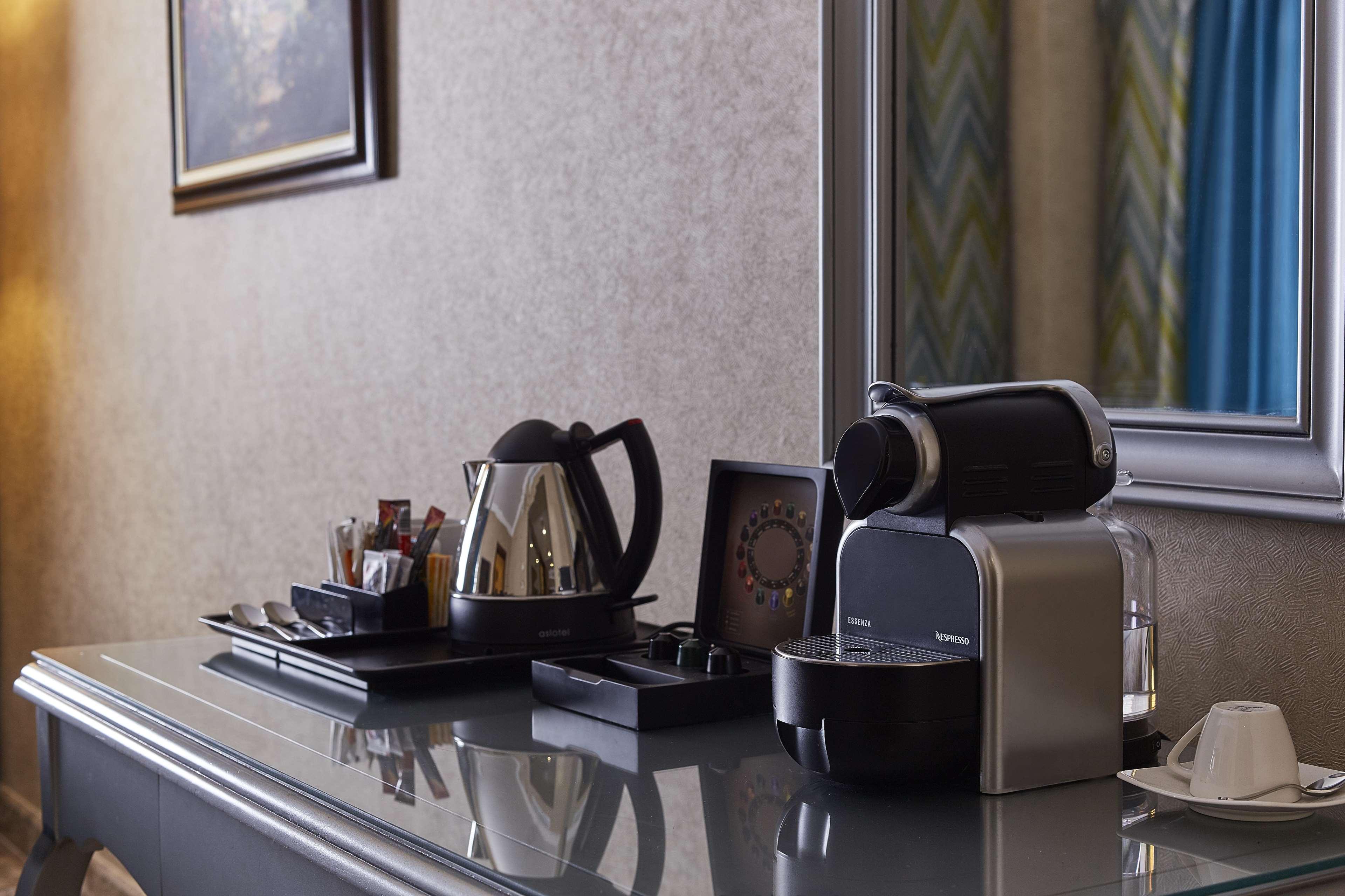 Hilton Alexandria Corniche Hotel Bagian luar foto A Nespresso machine in a hotel room